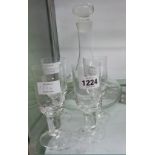 A Dartington glass ship's decanter sold with four Dartington glass Victoria sherry glasses (one