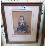 A gilt framed early 19th Century naive portrait watercolour of a seated lady with a book
