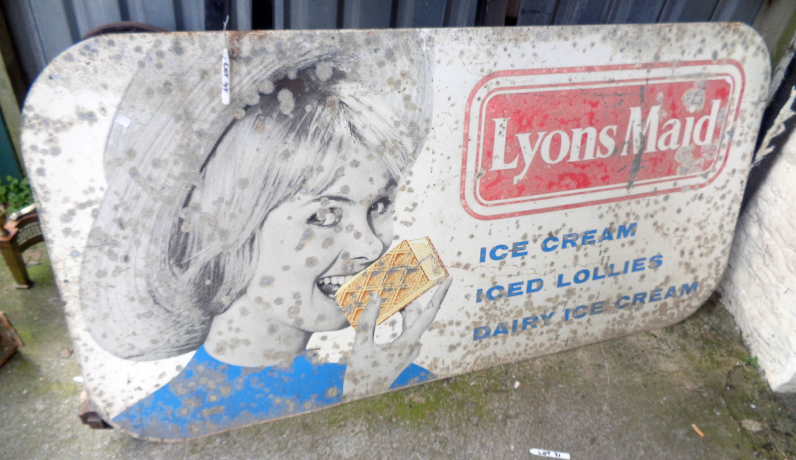 A large vintage printed aluminium Lyon's Maid ice cream sign