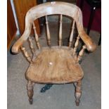 A 20th Century smoker's bow with moulded elm seat and set on turned supports - timber dry, some