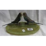 A green onyx desk stand with pair of cold painted bronze budgie figurines