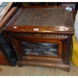 A 24" late 19th Century Anglo-Indian stained and carved oak storage chest with profuse decorative