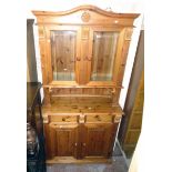 A 3' 4" modern polished pine two part dresser with decorative glazed top section over a base with