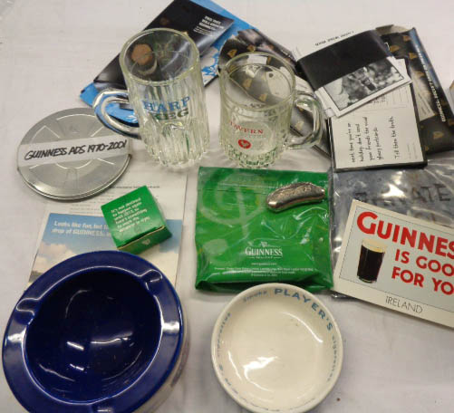 A collection of breweriana including Guinness advertising giveaways, Player's ashtray, Courage