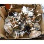 A box containing a quantity of silver plated items including a pair of three branch candelabra,