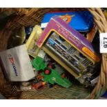 A basket containing a quantity of die cast cars, etc.