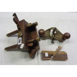 A vintage Stanley No.71 router plane, plough plane, and another