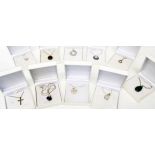 Ten boxed silver, white metal and other mounted pendants on chains