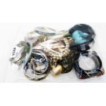 A bag containing a quantity of assorted costume jewellery including numerous bangles, etc.