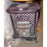 A 18 1/2" French Radiolet enamelled cast iron multi fuel stove with purple and silvered finish,
