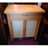 A 27 1/2" modern kitchen preparation unit with butcher's block style top, frieze drawer and pair