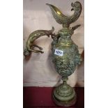 A Victorian cast brass wine ewer shaped decorative ornament of Classical design with figural
