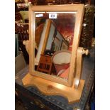 A modern stripped pine platform dressing table mirror with oblong plate and serpentine base