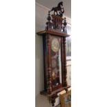 A large early 20th Century walnut cased Vienna style regulator wall clock with ornate cast horse