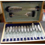 A polished wood cased set of twelve each silver plated ornate fish knives and forks and pair of