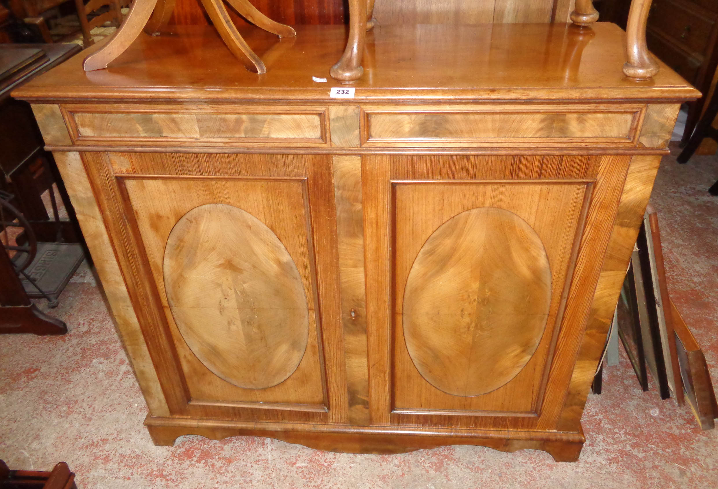A 3' 7 1/2" mahogany and mixed wood chiffonier with two secret frieze drawers and pair of oval