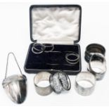 A silver decanter drip pocket - sold with five silver napkin rings, another and menu holders