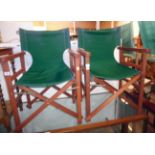 A pair of stained wood and canvas director's style folding chairs