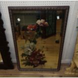 A early 20th Century stained gesso framed bevelled oblong wall mirror with painted floral decoration