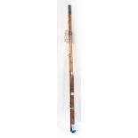 A vintage three section cane fishing rod