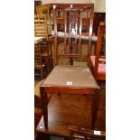 A set of four Edwardian inlaid mahogany framed high back dining chairs with pierced splats and