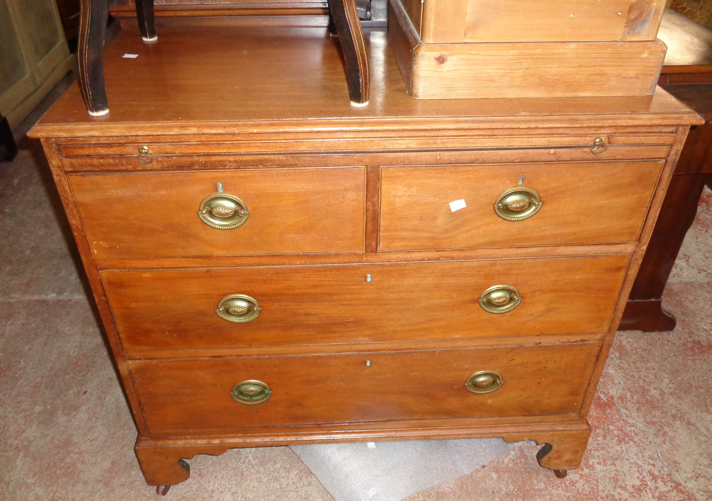 A 3' 1" 19th Century mahogany bachelor's chest with brushing slide, two short and two long graduated