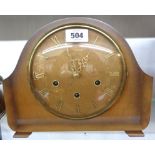 A mid 20th Century stained walnut effect cased mantel clock with Smiths eight day chiming movement