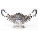 An 18" (overall) late Victorian Scottish silver ornate pedestal rose bowl of oval form with gilt