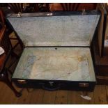 A 30" vintage trunk as a coffee table, set on chrome plated legs