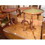 A reproduction mahogany pedestal wine table - sold with two others - various condition