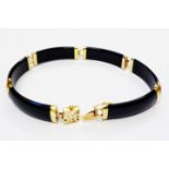 A marked 585/14k yellow metal mounted oriental black onyx curved panel link bracelet with seal style