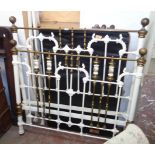 A 4' 6" late Victorian brass and iron double bedstead with printed porcelain spindles, side rails