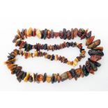 A vintage Baltic amber mixed colour natural bead necklace