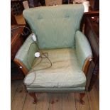 A vintage upholstered boudoir armchair with polished wood part show frame and cabriole front legs