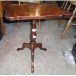 A 17 1/2" reproduction mahogany pedestal wine table with moulded oblong top, set on tuned pillar and