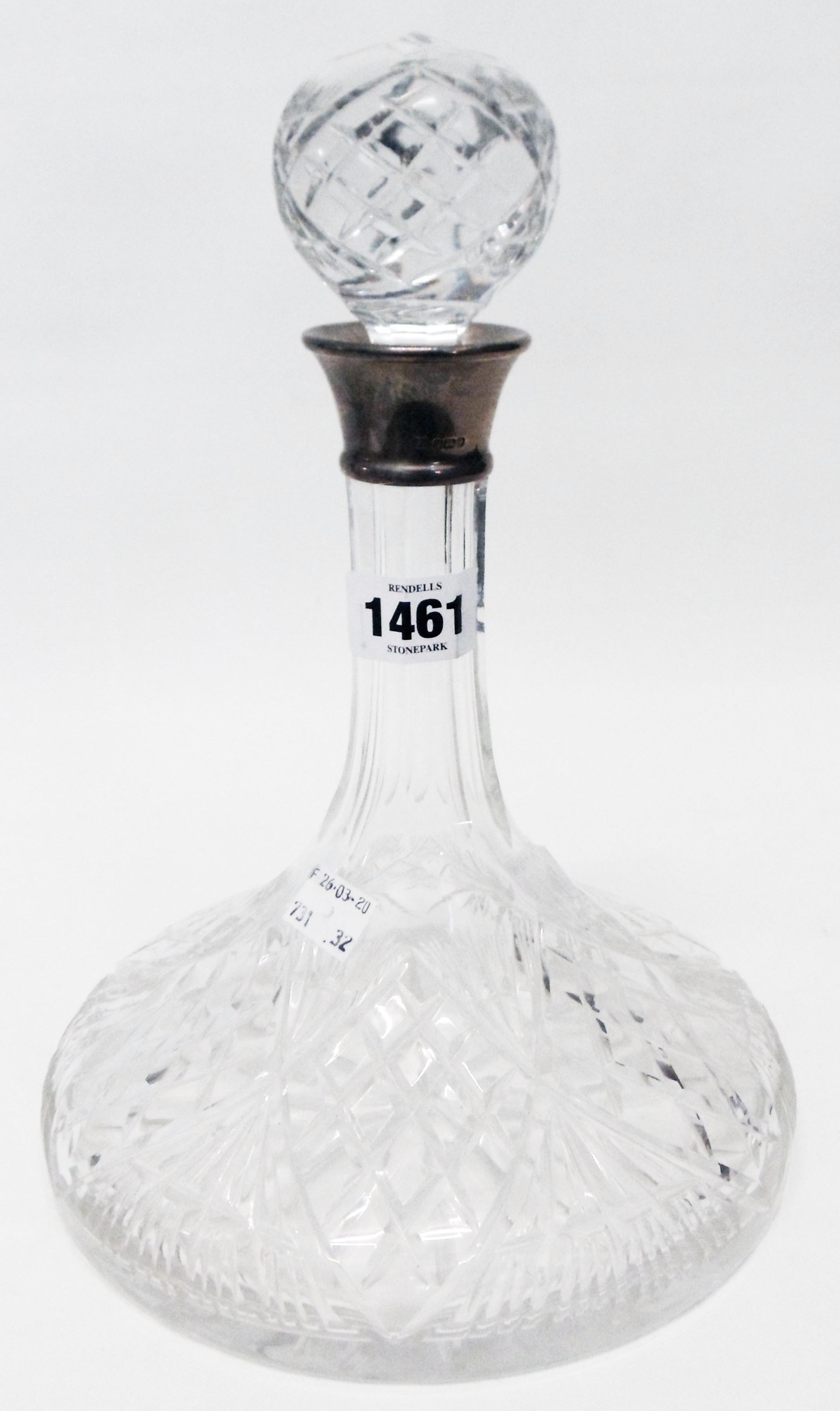 A cut glass ship's decanter with star cut base and silver collar - Sheffield 1979