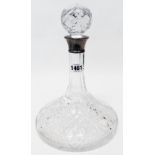 A cut glass ship's decanter with star cut base and silver collar - Sheffield 1979