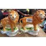 A pair of continental lion figurines