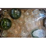 A box containing assorted glassware including drinking vessels, cut ice plates, small fishing float,
