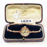 An early 20th Century rose gold lady's wristwatch with expanding bracelet - over wound