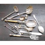 A collection of good quality silver plated cutlery items including strainer ladles, muffin fork,