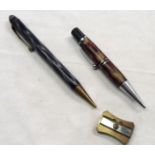 Two propelling pencils and a Faber Castell Minfix propelling pencil sharpener