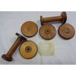 A set of four coasters and a pair of candlesticks made from First World War period uniform factory