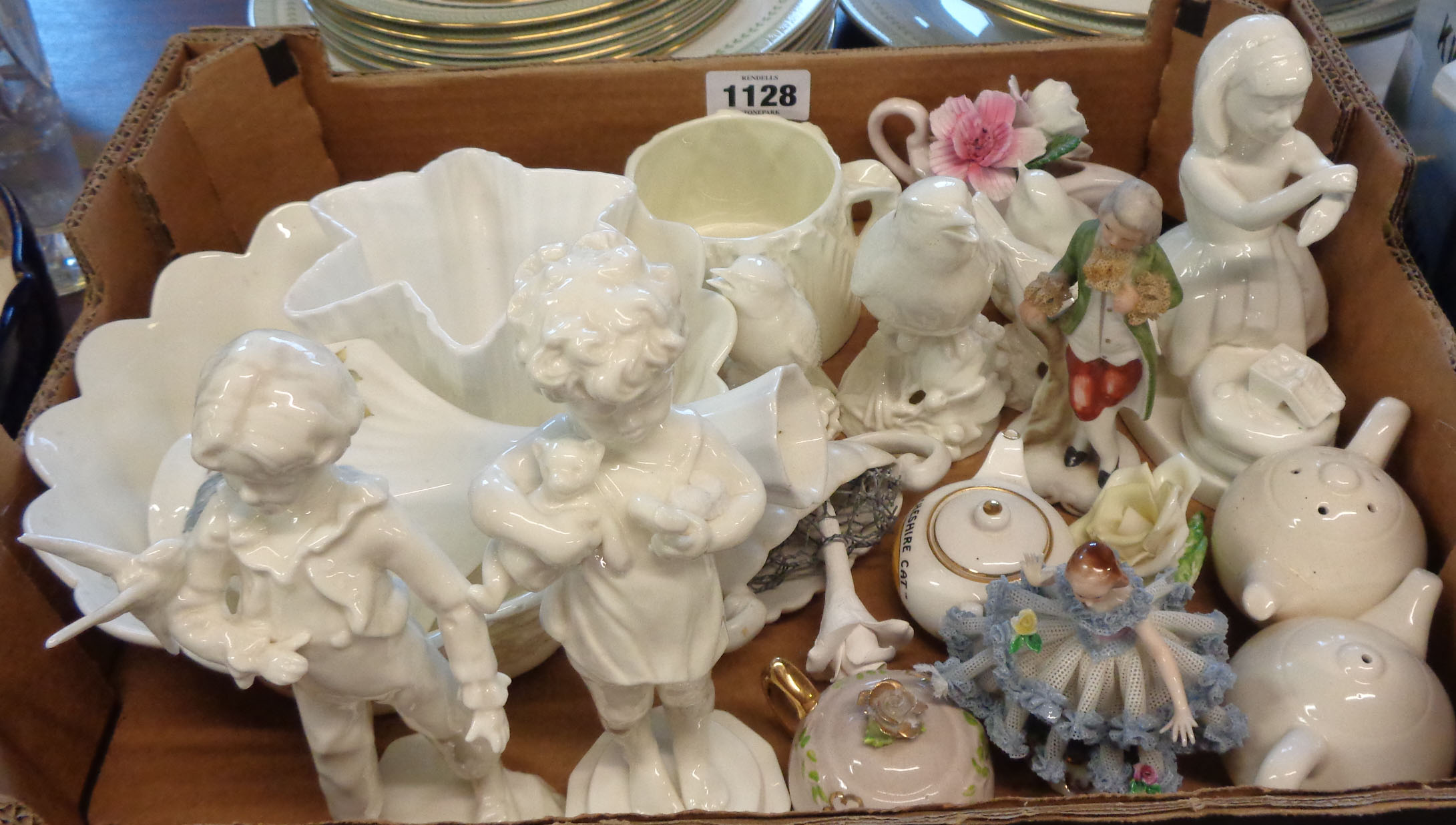 A box containing a Royal Worcester blanc de chine bowl, vase, and sugar bowl, various blanc de chine