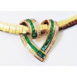 A marked 14k yellow metal open heart twist pattern pendant by Columbian Emeralds International, with
