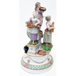 A Meissen figural centrepiece depicting child musicians and instruments, designed to house a musical