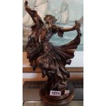 A modern bronze figure of a dancing lady