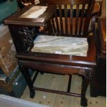 A 22" Chinese polished rosewood telephone table with marble inset surfaces, set on ornate mask