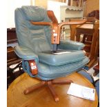 A modern polished bentwood and metal framed swivel easy chair upholstered in green leather and