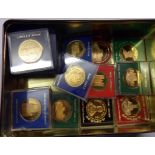 A collection of encapsulated proof bronze and other commemorative coins
